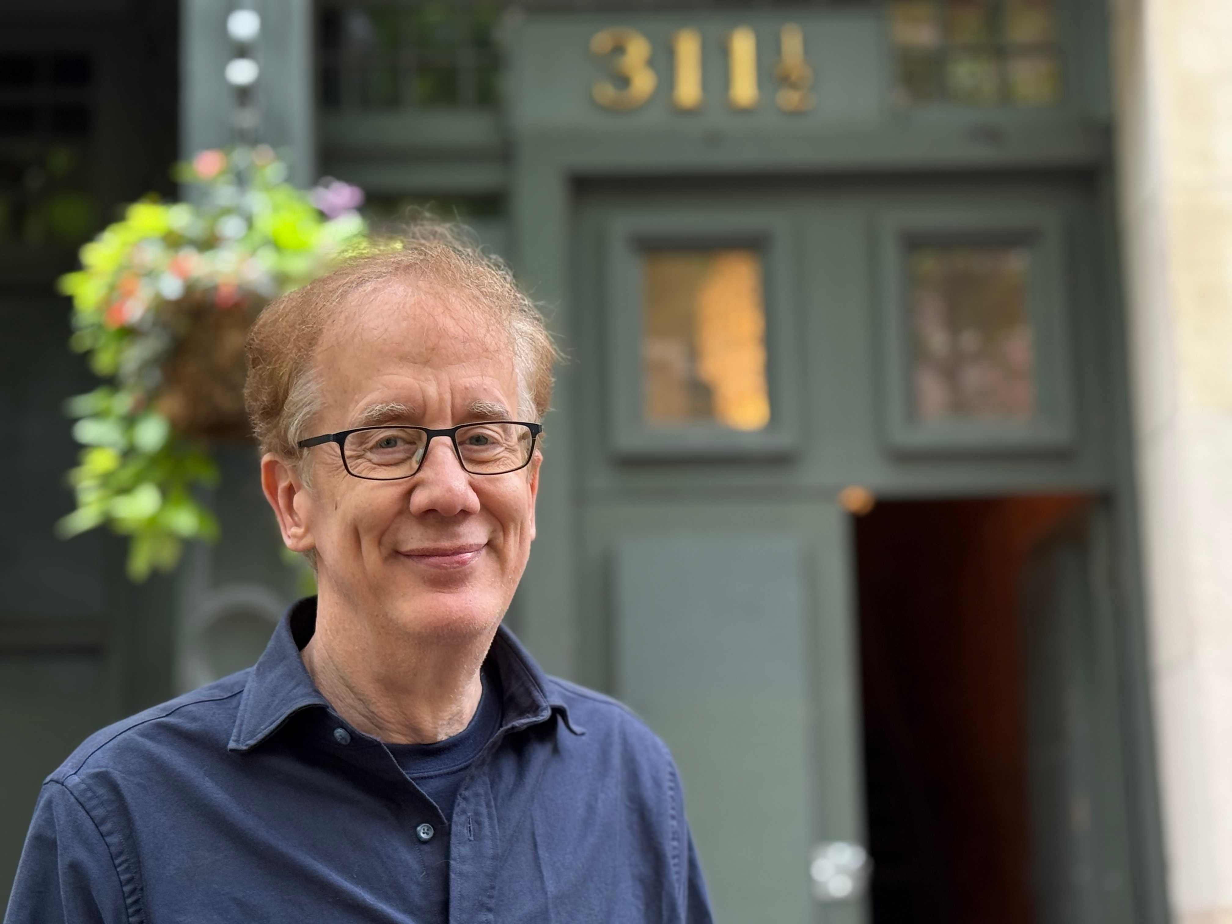 Andrew Conru outside the building